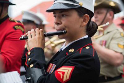 U.S. Marine playing the piccolo; rent piccolos here.